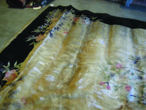 buckling of silk rug