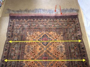 Clues of tension change and potential shrinking risk -- arrows show problems in weft and warp. 