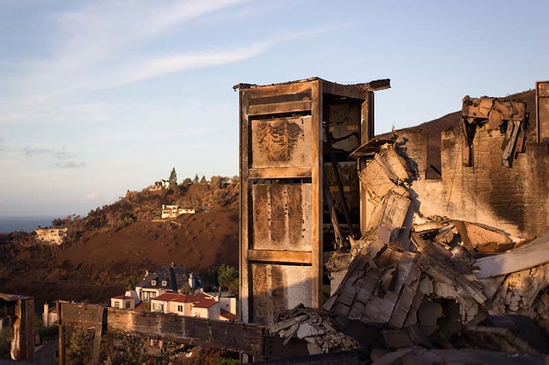 Malibu, CA: 2018 Woolsey fire aftermath: burned rubble of a ruined structure. Shot at dawn about 2 weeks after the November fire.