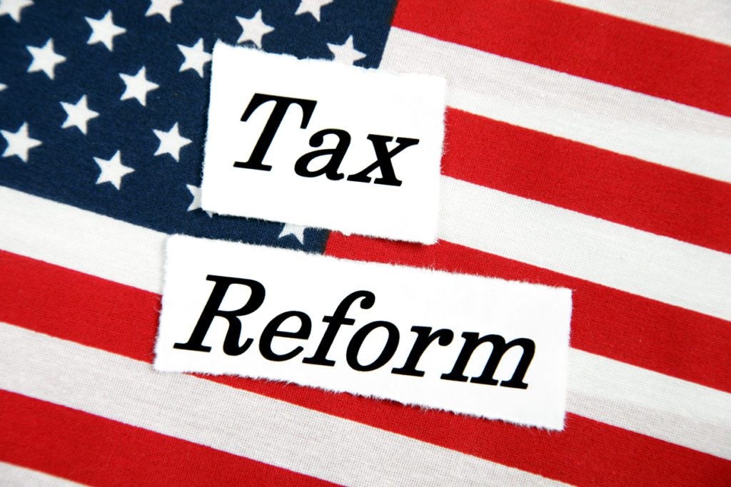 The words Tax reform sitting on an American flag