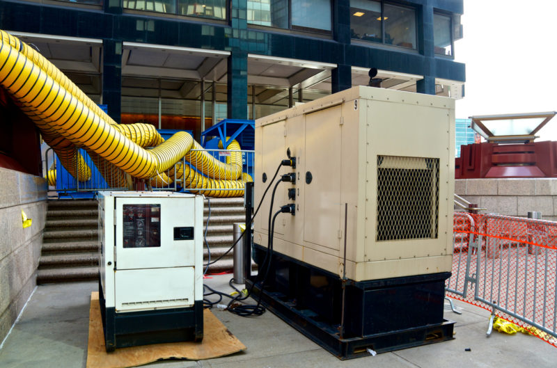 "New York City, USA - December 12, 2012: Six weeks after Hurricane Sandy machinery to create heated air is seen at the entrance plaza to One New York Plaza, a skyscraper in Lower Manhattan which has large financial services corporations as tenants."