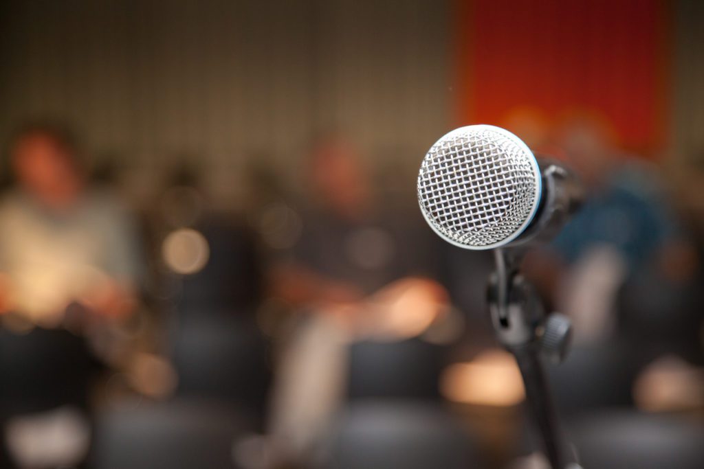 microphone at lectern at an event or presentation or lecture.