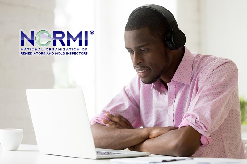 African american man wearing headphones using laptop looking at computer screen, smiling young black businessman learning studying online, watching video or making call with pc internet application