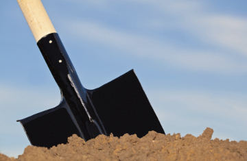 Shovel in the heap of ground