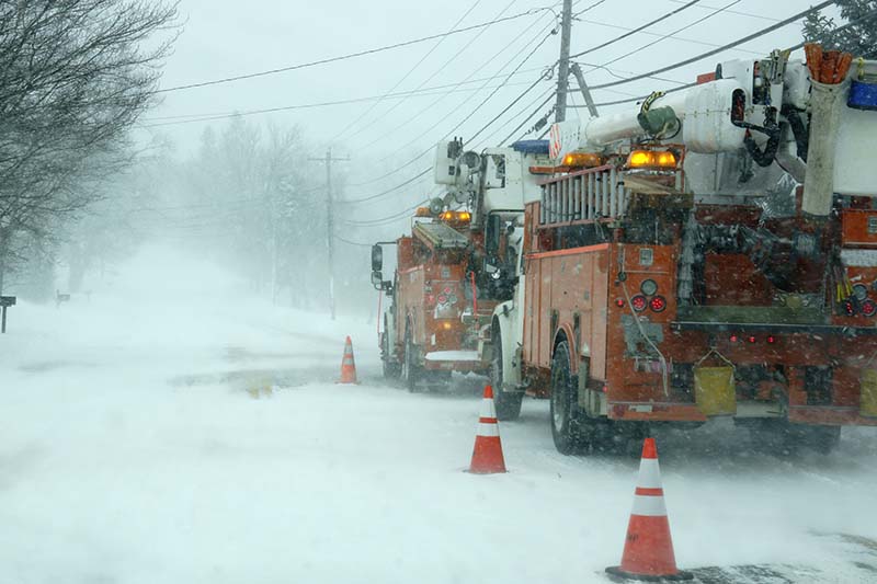 Downed power lines be repaired by two crews in Maine Snow storm.