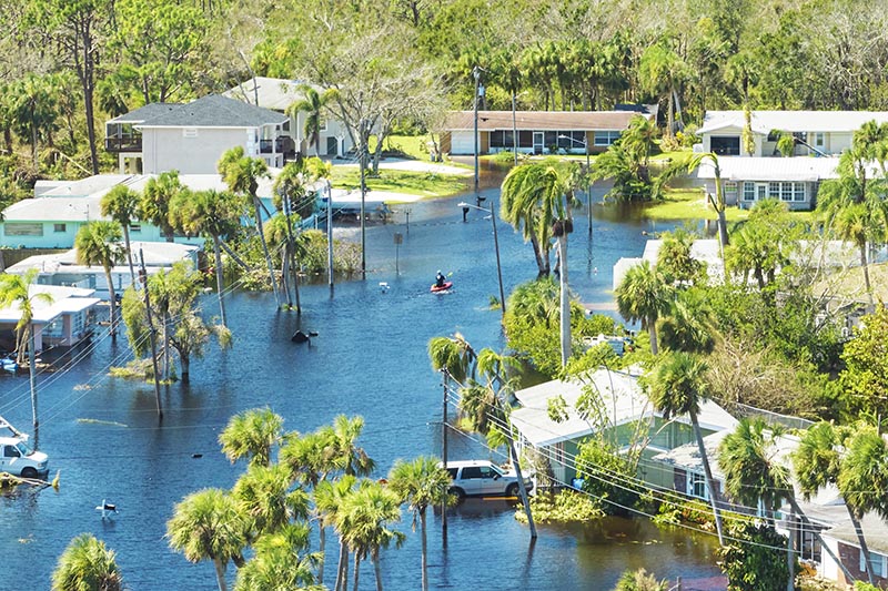 Surrounded by hurricane Ian rainfall flood waters homes in Florida residential area. Consequences of natural disaster.