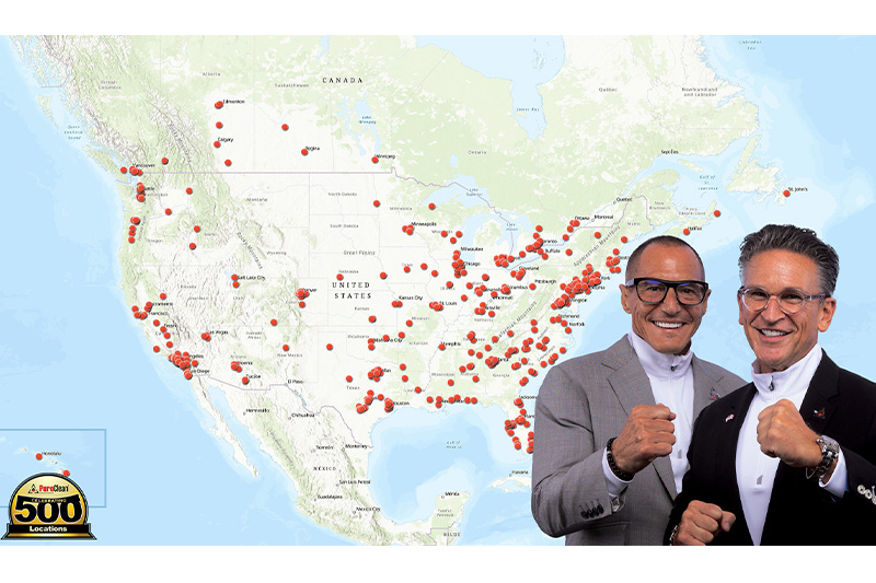 PuroClean’s owners, Vice Chairman, Frank Torre and Chairman & CEO, Mark W. Davis, with the 500 location map.