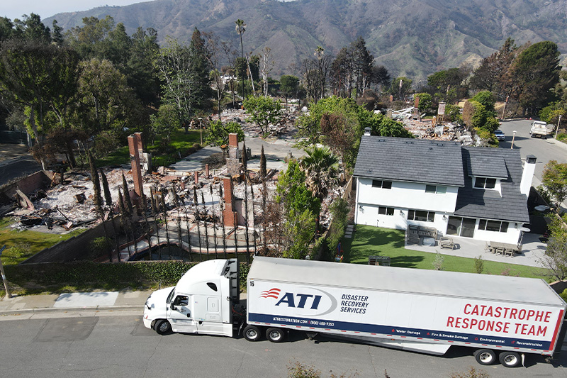 ATI Restoration truck in front of the LA wildfire damage
