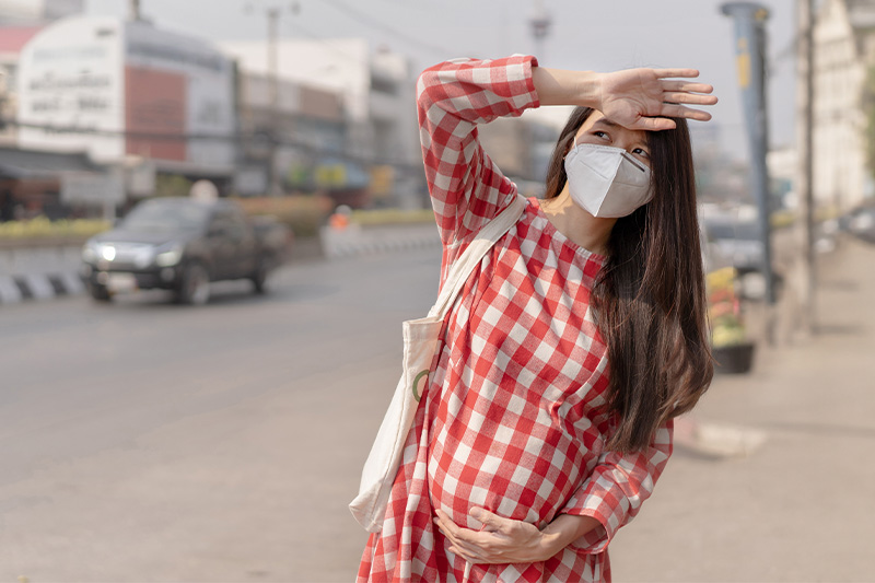 pregnant woman in facemask