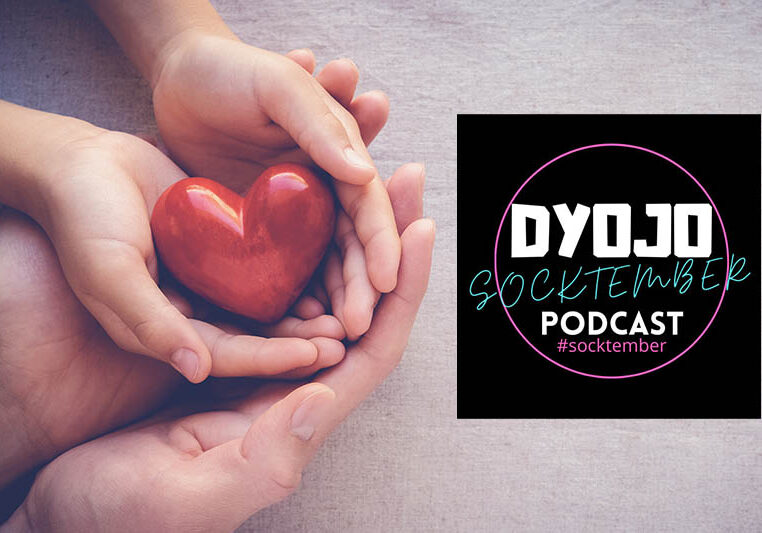 adult and child hands holding red heart, health care love and family concept