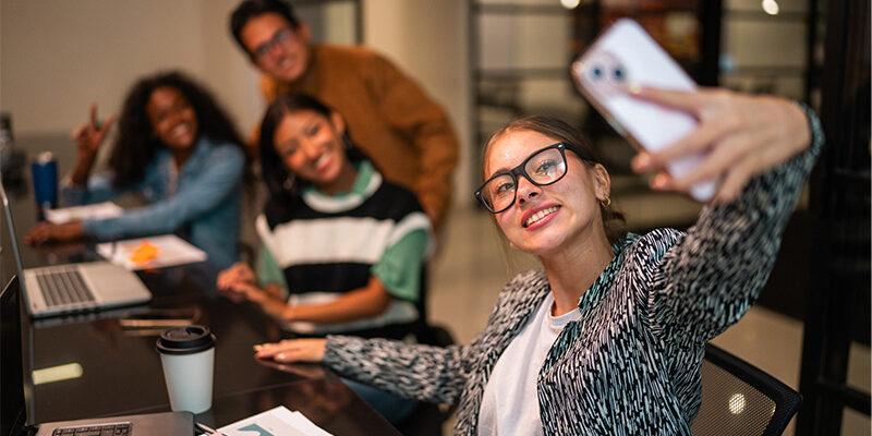 Gen Z on phone at work