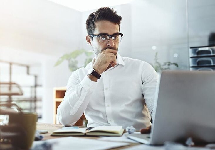 Shot of a young businessman working in an office