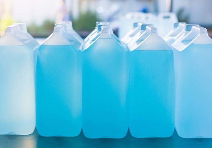 Alcohol for cleaning and sanitizing is contained in gallons in the warehouse. Many gallon alcohol gel for sanitizing Coronavirus Covid-19. Products for sale to anti Coronavirus protection (Covid 19).