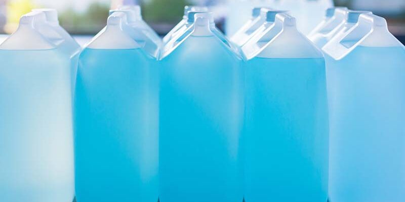 Alcohol for cleaning and sanitizing is contained in gallons in the warehouse. Many gallon alcohol gel for sanitizing Coronavirus Covid-19. Alcohol for cleaning and sanitizing is contained in gallons in the warehouse. Many gallon alcohol gel for sanitizing Coronavirus Covid-19. Products for sale to anti Coronavirus protection (Covid 19).