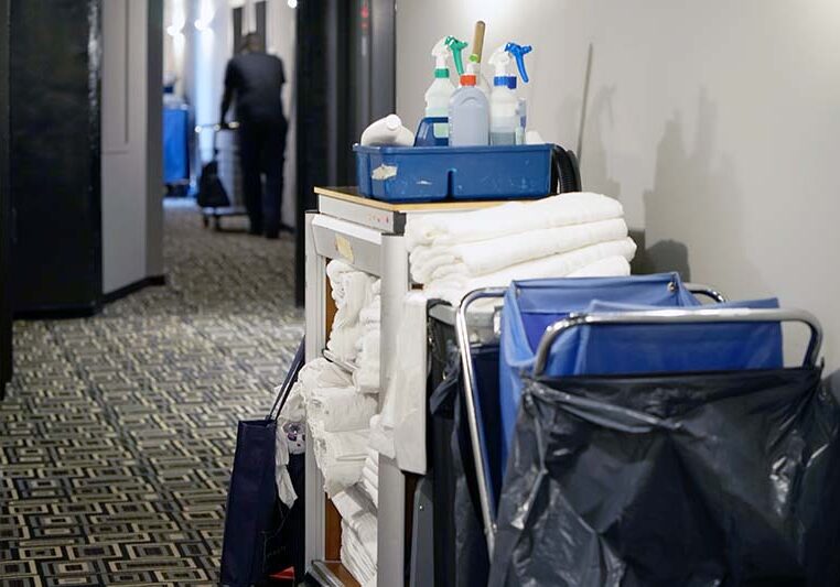 Cleaners trolley with cleaning equipments at hotel