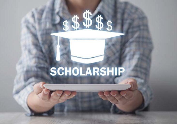 Business girl holding graduation cap. Scholarship