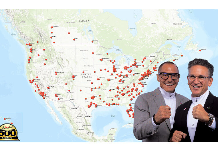 PuroClean’s owners, Vice Chairman, Frank Torre and Chairman & CEO, Mark W. Davis, with the 500 location map.