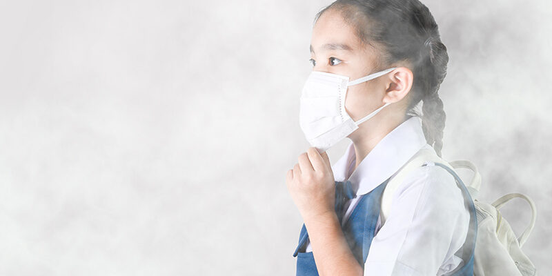 School girl in smog