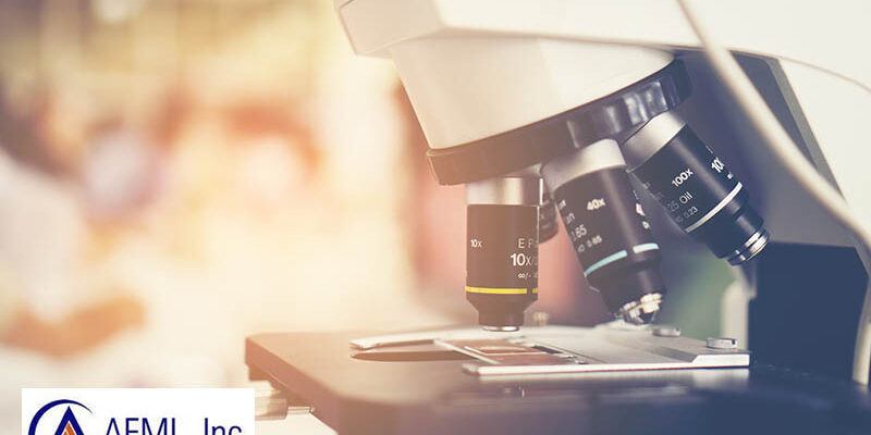 Close-up shot of microscope with metal lens at laboratory.