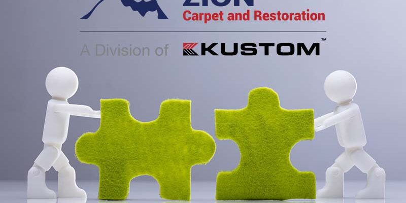 Two Miniature Human Figures Solving Green Jigsaw Puzzles Side View Of Two Miniature Human Figures Solving Green Jigsaw Puzzles On Grey Background