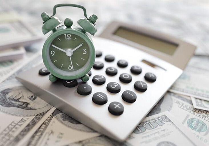 clock, calculator and money