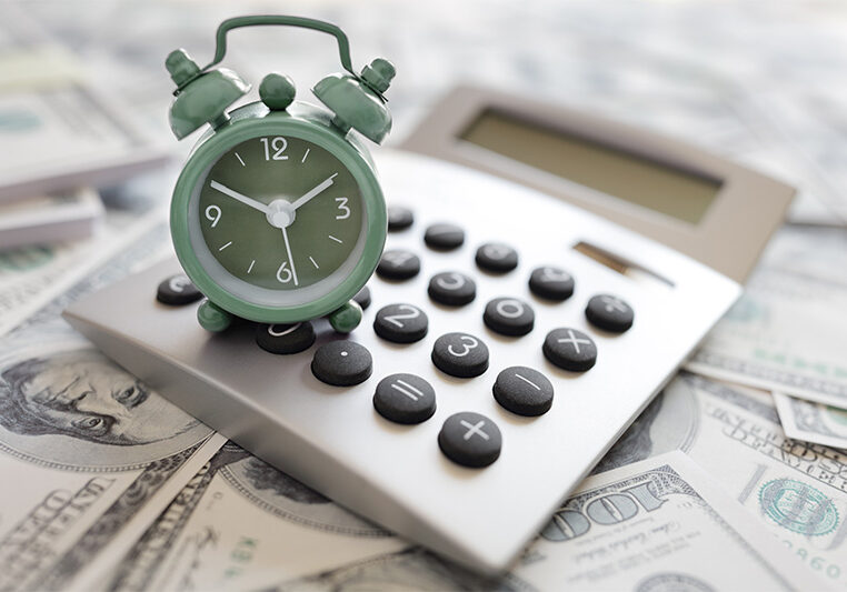 clock, calculator and money