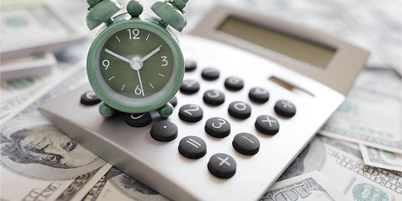 clock, calculator and money