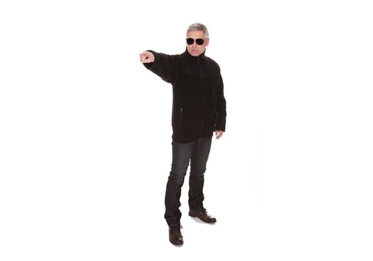 Mature security man standing over white background
