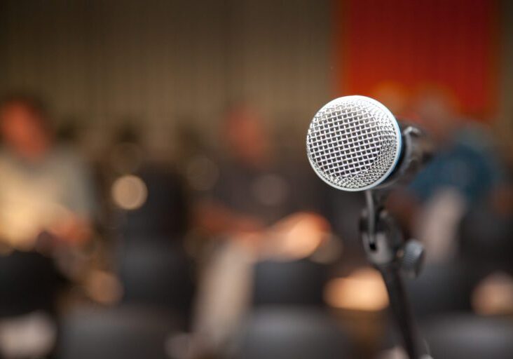 microphone at lectern at an event or presentation or lecture.