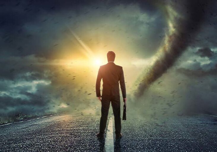 Businessman watching a tornado. Concept for success.