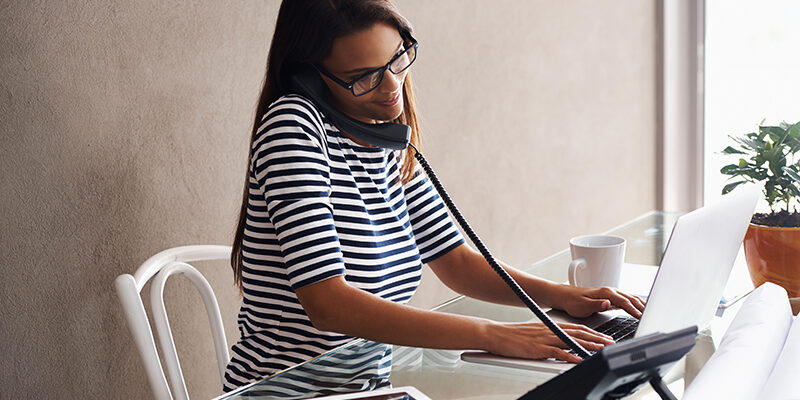 Shot of a young businesswoman talking on the phone while working on  her laptophttps://195.154.178.81/DATA/i_collage/pi/shoots/783397.jpg