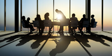 Group of Business Having a Meeting during Sunset