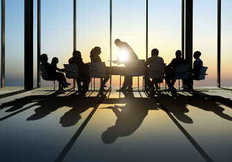 Group of Business Having a Meeting during Sunset